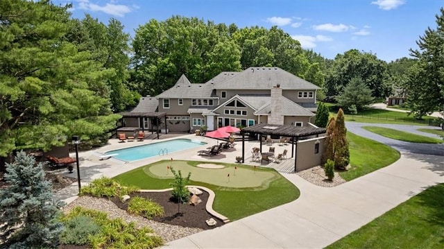 outdoor pool featuring a patio, a hot tub, a gazebo, and fence