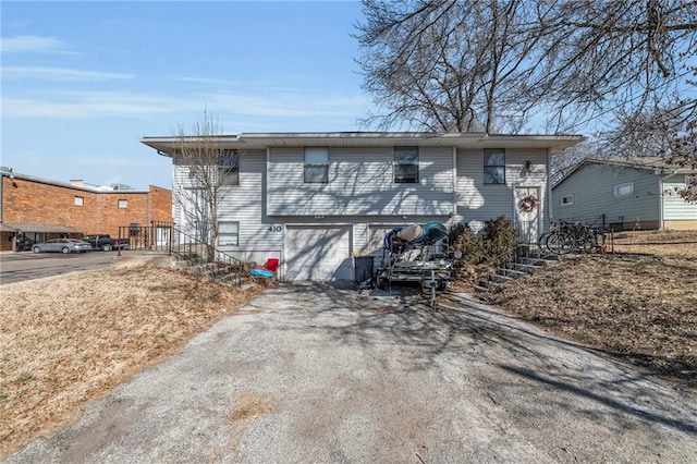 exterior space with driveway and an attached garage