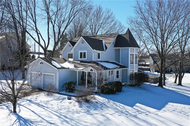 victorian-style house with an attached garage