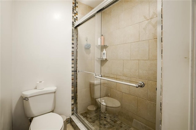 full bath with toilet and a shower stall