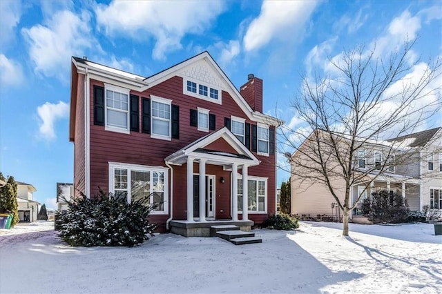 view of front of home with a chimney