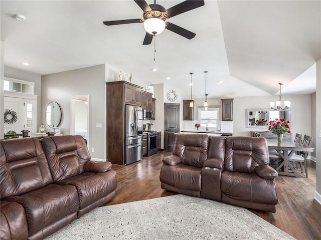 living area with lofted ceiling, baseboards, dark wood-type flooring, and recessed lighting