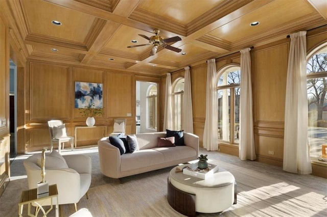 interior space with wooden ceiling, coffered ceiling, a decorative wall, and crown molding