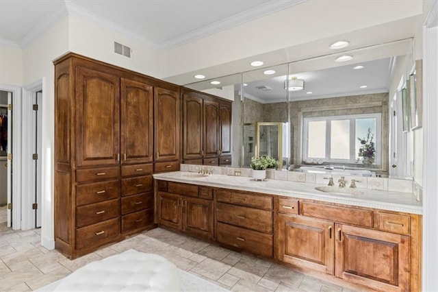 bathroom with double vanity, visible vents, ornamental molding, a shower stall, and a sink