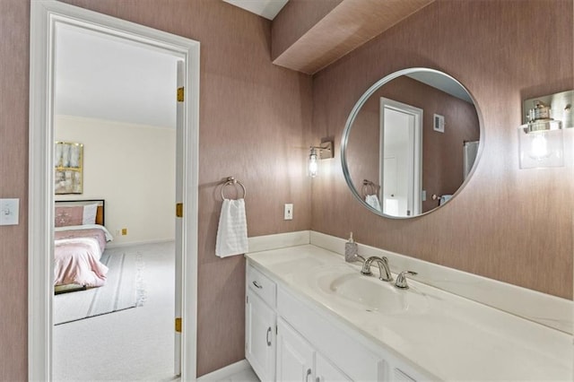 bathroom with vanity and baseboards