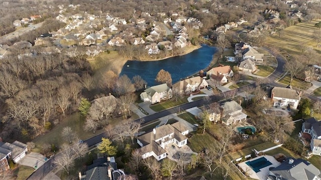 bird's eye view featuring a water view and a residential view