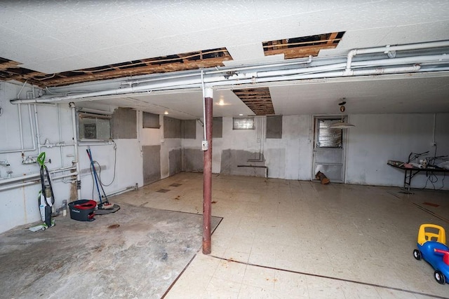 unfinished below grade area featuring tile patterned floors