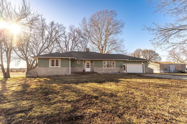 single story home with a garage, stone siding, driveway, and a chimney