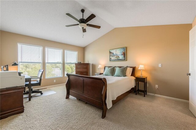 1716 NW 54th Ter, Kansas City, MO 64118 - bedroom with vaulted ceiling, carpet flooring, a desk, baseboards, and ceiling fan