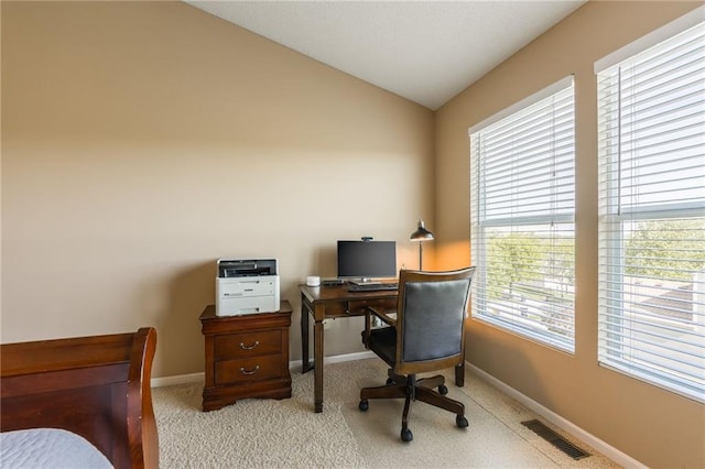1716 NW 54th Ter, Kansas City, MO 64118 - office with healthy amount of natural light, lofted ceiling, baseboards, and light colored carpet