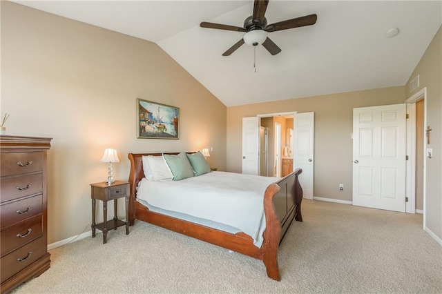 1716 NW 54th Ter, Kansas City, MO 64118 - bedroom with vaulted ceiling, baseboards, light carpet, ceiling fan, and ensuite bath