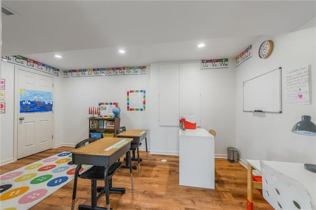 1716 NW 54th Ter, Kansas City, MO 64118 - office space featuring wood finished floors, recessed lighting, and baseboards