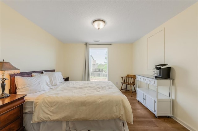 1716 NW 54th Ter, Kansas City, MO 64118 - bedroom featuring wood finished floors and baseboards