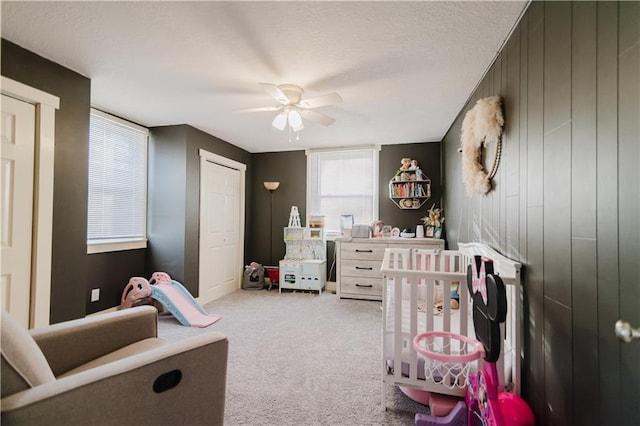 recreation room featuring carpet and a ceiling fan