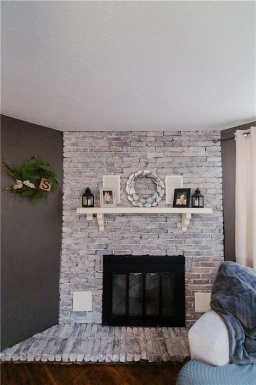 room details with a fireplace and wood finished floors