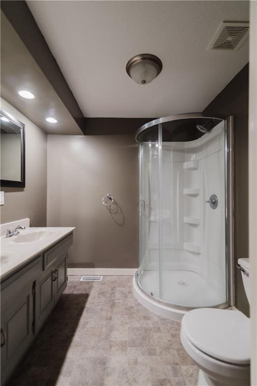 full bath with toilet, a stall shower, visible vents, and a sink