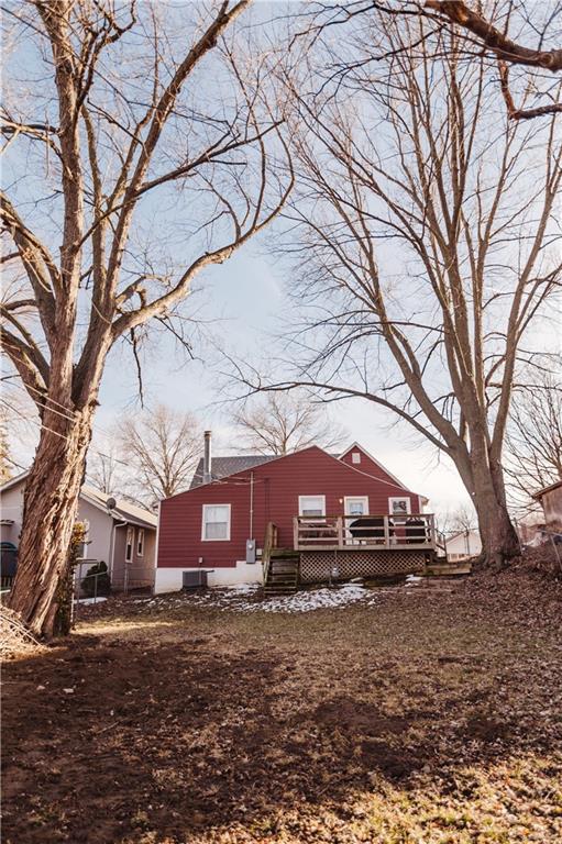 rear view of property featuring a deck