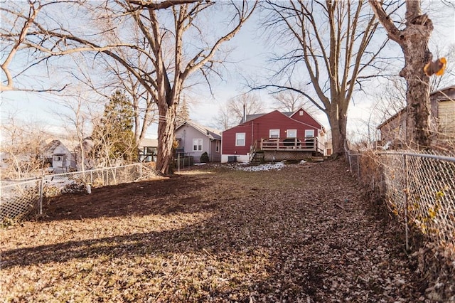 view of yard with a fenced backyard and a wooden deck