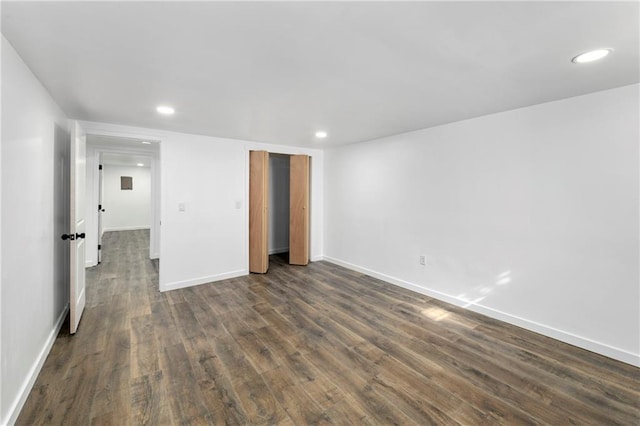 unfurnished bedroom featuring baseboards, dark wood finished floors, a closet, and recessed lighting