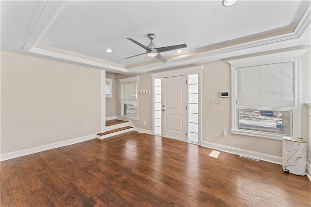 foyer entrance featuring a tray ceiling, recessed lighting, wood-type flooring, a ceiling fan, and baseboards