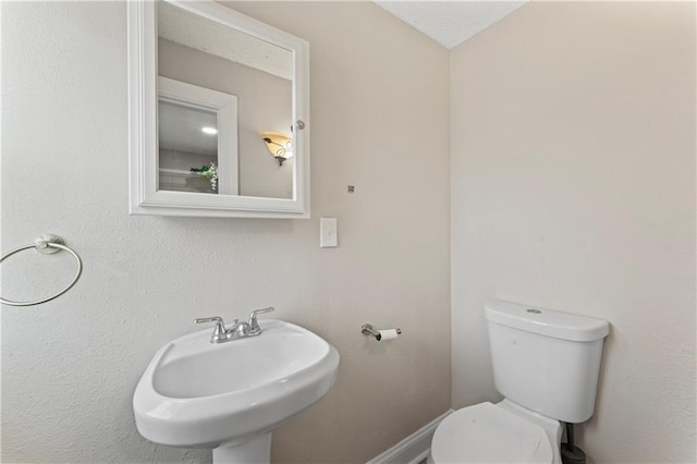 bathroom with a sink and toilet