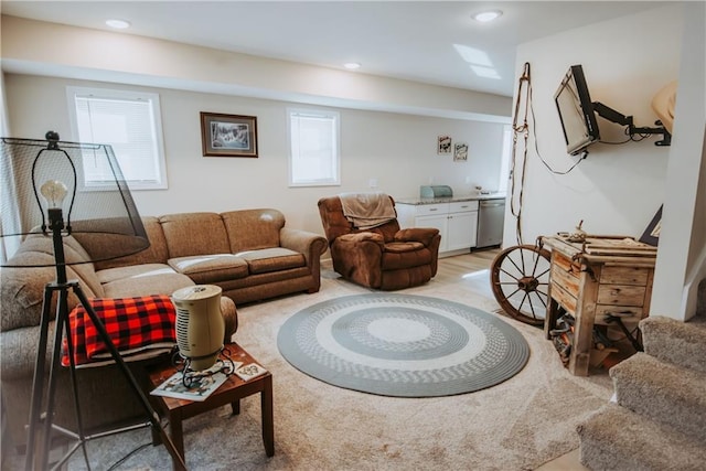 living area featuring stairs, light wood-style flooring, and recessed lighting