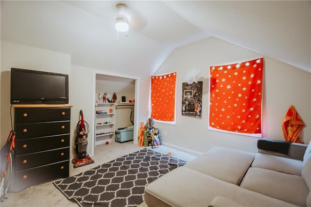 playroom with carpet floors and vaulted ceiling