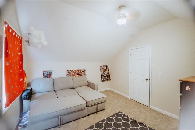 living area featuring vaulted ceiling, carpet, and baseboards