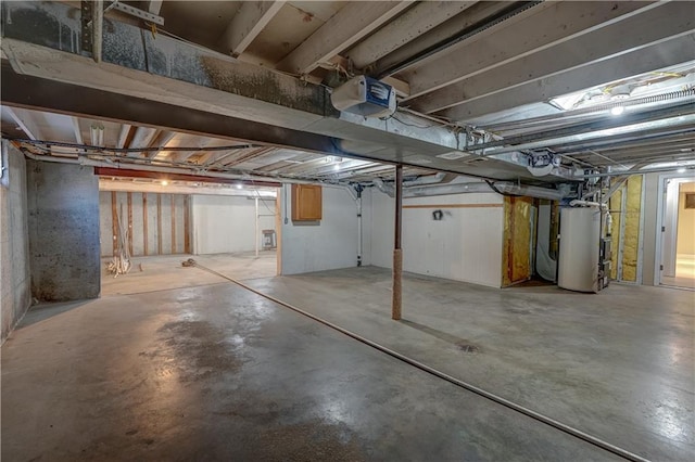 unfinished basement featuring gas water heater