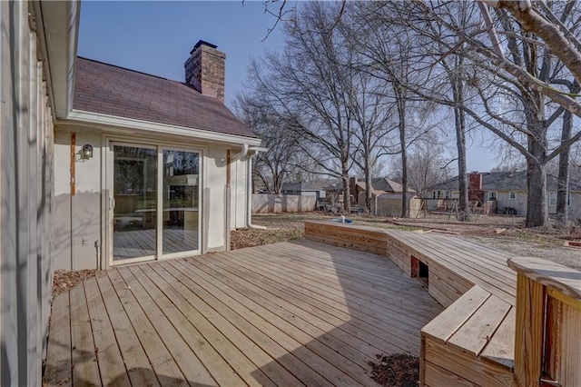 wooden terrace with fence and a residential view