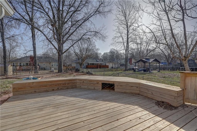 deck featuring a yard, a residential view, and fence