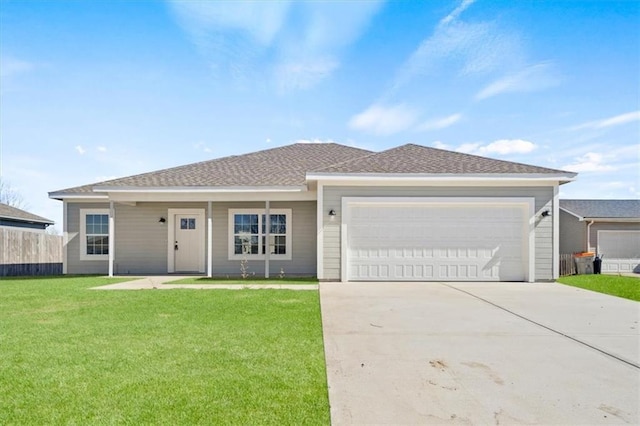 ranch-style home with a garage, a shingled roof, fence, driveway, and a front yard