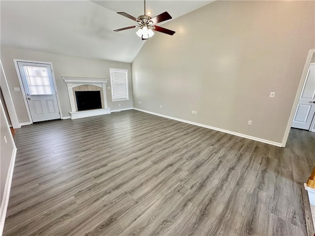 unfurnished living room featuring baseboards, a fireplace, a ceiling fan, and wood finished floors