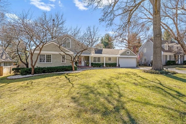 new england style home featuring an attached garage, fence, a front lawn, and concrete driveway