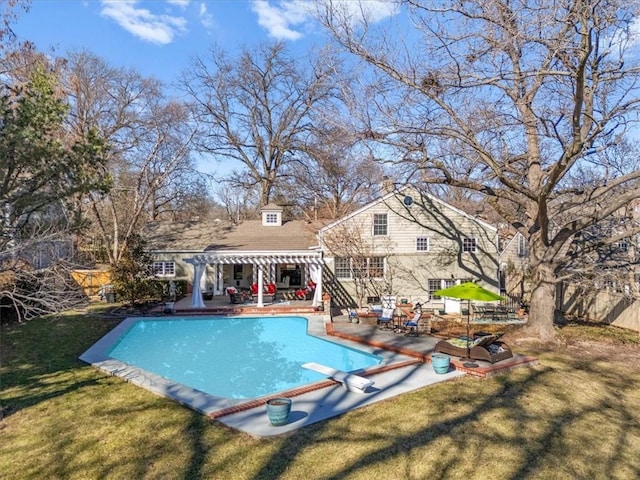 outdoor pool featuring fence, a diving board, a lawn, a pergola, and a patio area