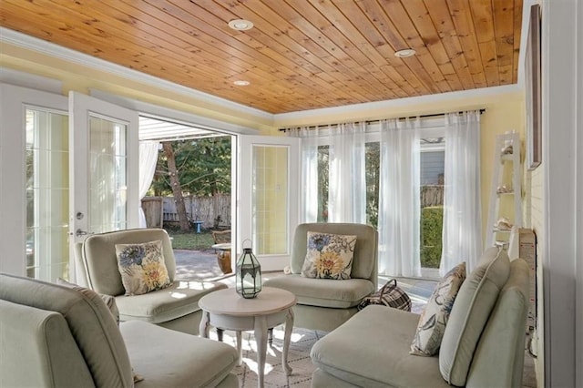 sunroom / solarium with wooden ceiling and a raised ceiling