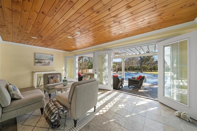 living room featuring wooden ceiling, a sunroom, and crown molding