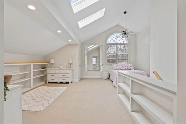 bedroom featuring baseboards, vaulted ceiling with skylight, carpet, and recessed lighting