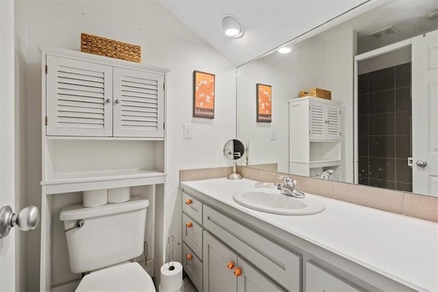 bathroom featuring recessed lighting, visible vents, toilet, vaulted ceiling, and vanity