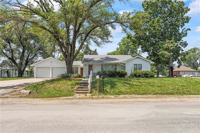 ranch-style home with an outdoor structure and a front yard