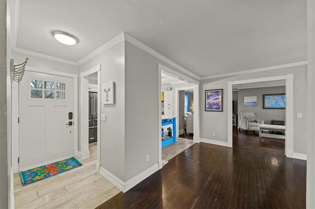 entryway with wood-type flooring and baseboards