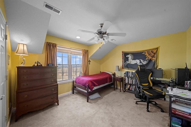 bedroom featuring visible vents, baseboards, ceiling fan, lofted ceiling, and carpet flooring