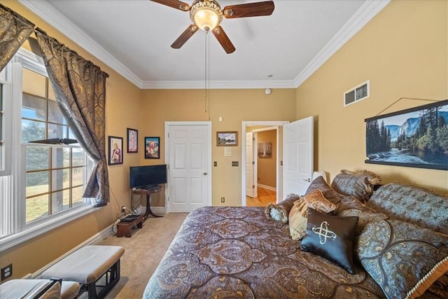 carpeted bedroom with crown molding, baseboards, visible vents, and ceiling fan