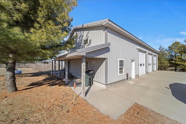 view of home's exterior with a detached garage