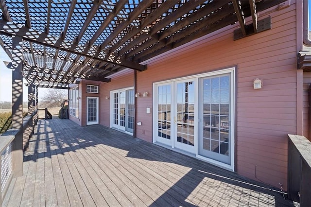 wooden deck with french doors and a pergola