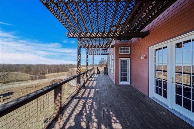 wooden terrace with french doors and a pergola