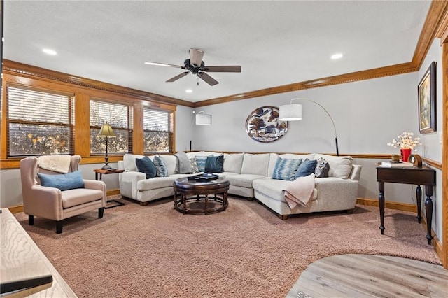 carpeted living room with recessed lighting, ornamental molding, a ceiling fan, a textured ceiling, and baseboards