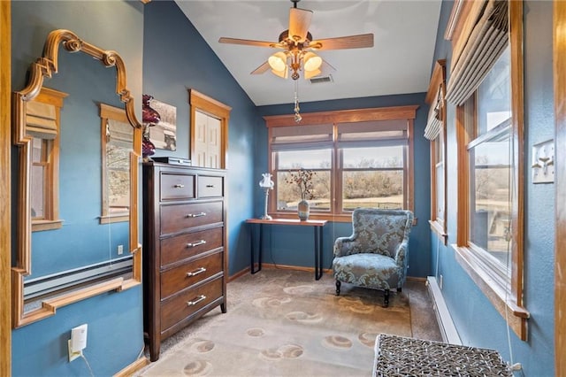 sitting room featuring carpet, a baseboard radiator, visible vents, vaulted ceiling, and baseboards