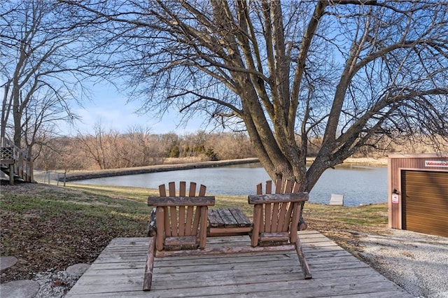 wooden deck featuring a water view