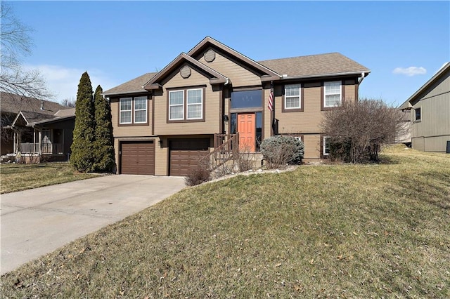 split foyer home with driveway, a front yard, and a garage